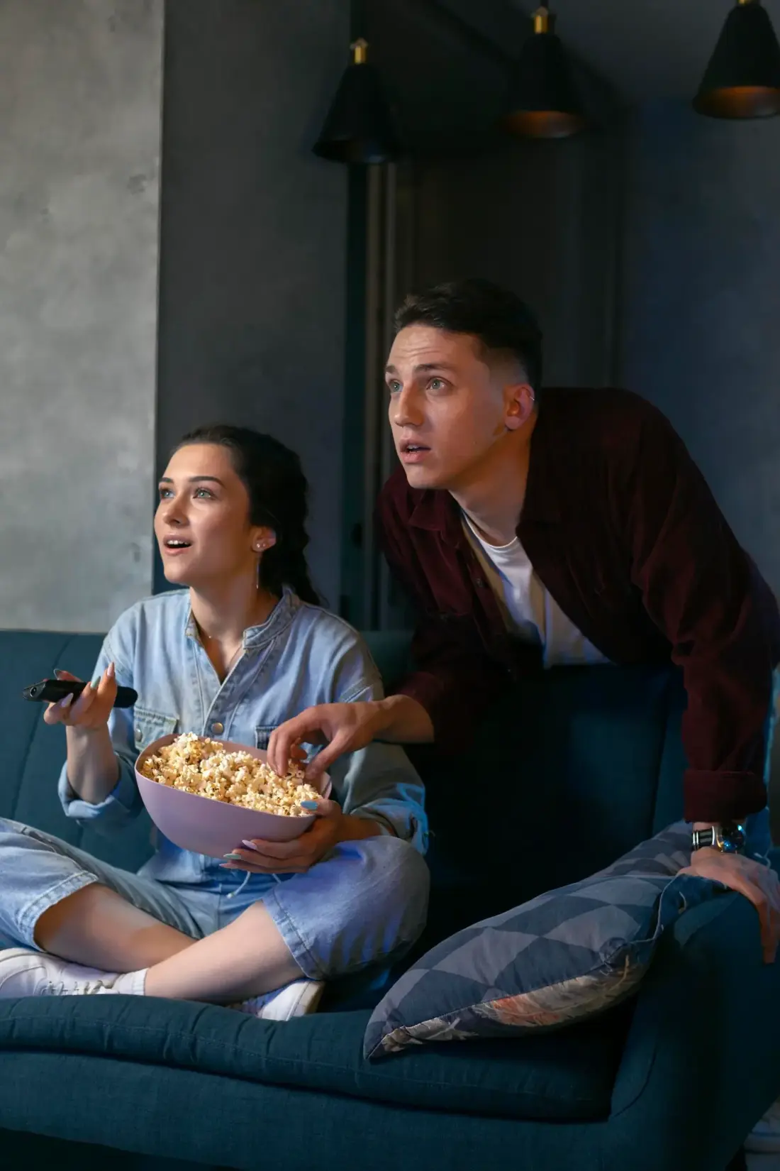Family watching First Class IPTV streaming together on a big screen